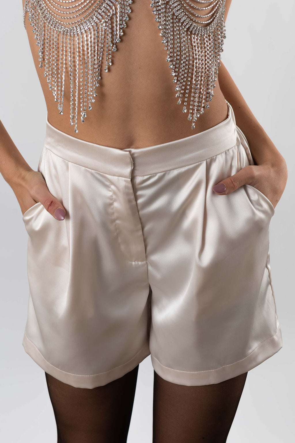 close up of women's satin shorts with side pockets