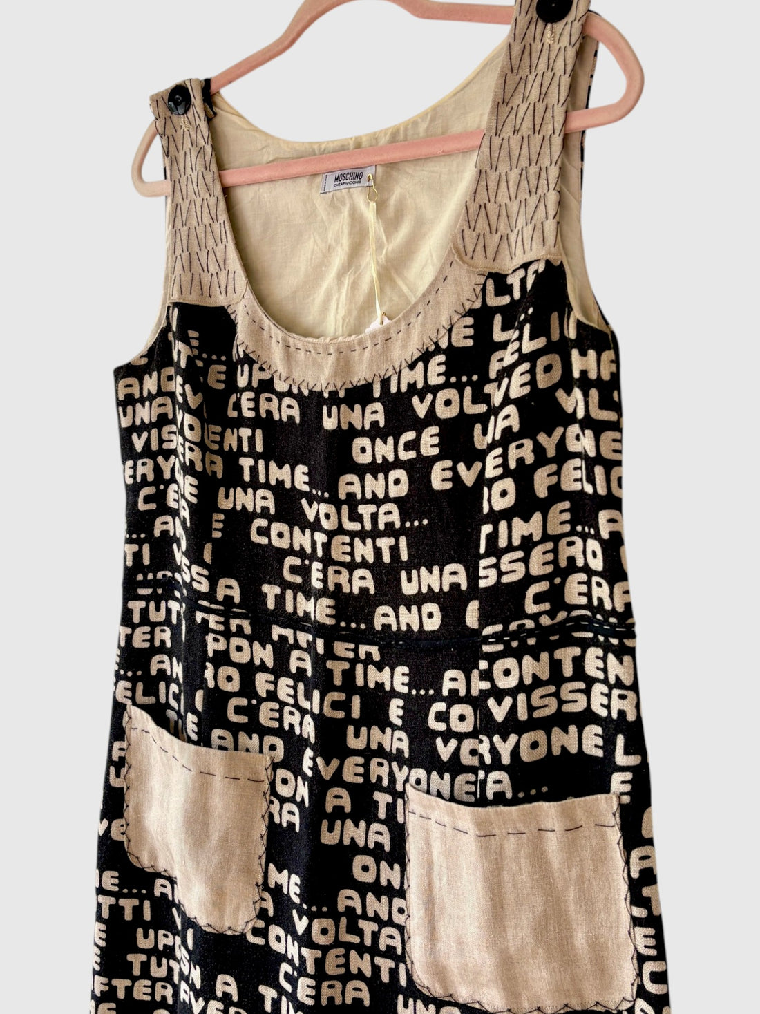Side view of late 1990s Moschino storybook print dress showing pocket detail