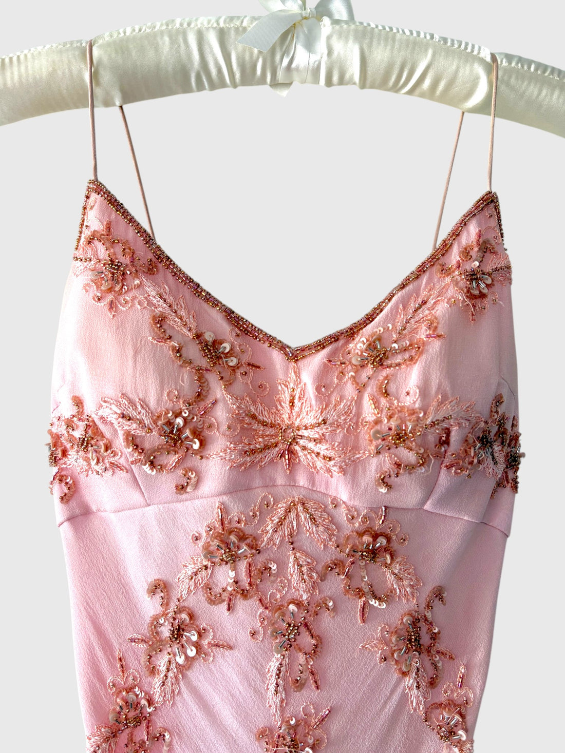 Detail of floral beadwork sequins and embroidery on vintage pink silk gown