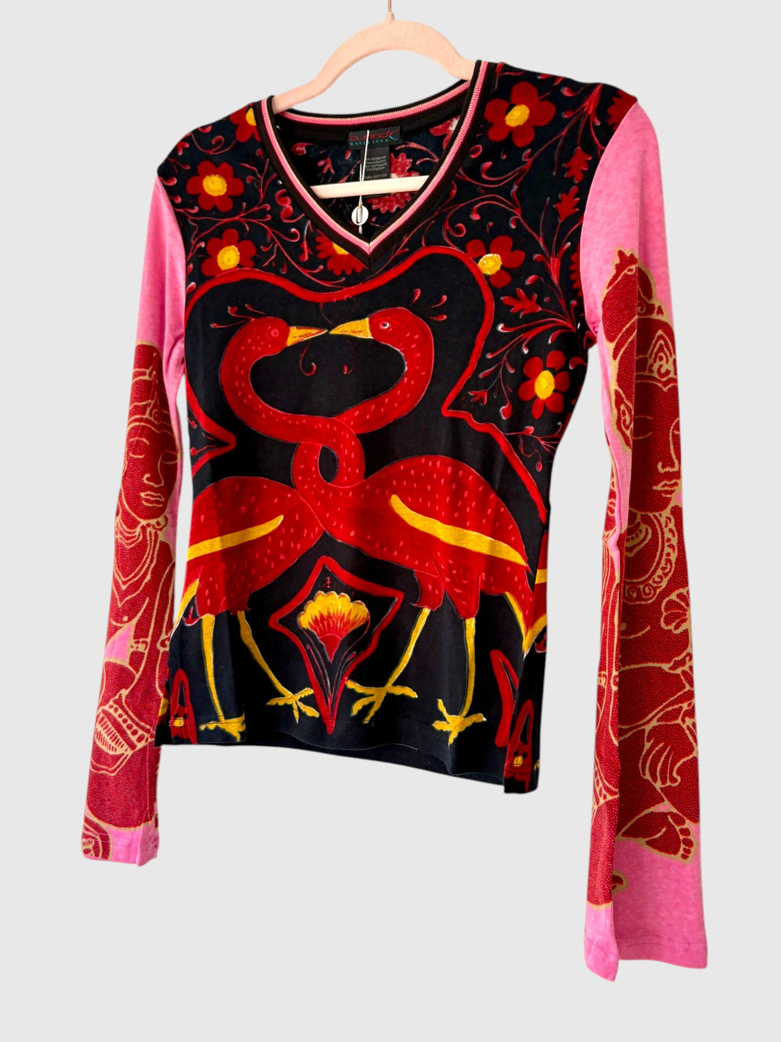 Vintage Custo Barcelona long sleeve top featuring striped V neckline, vibrant red bird motif and pink ornamental sleeves