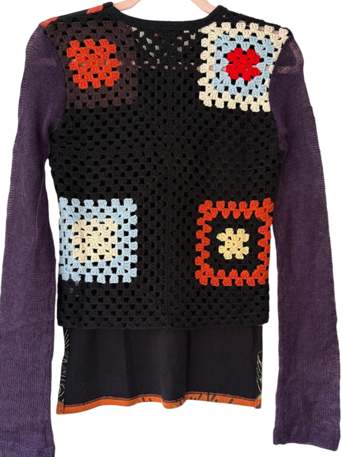 Multicolored granny square crochet back on archival Custo Barcelona top featuring orange, blue, cream and black open knit squares
