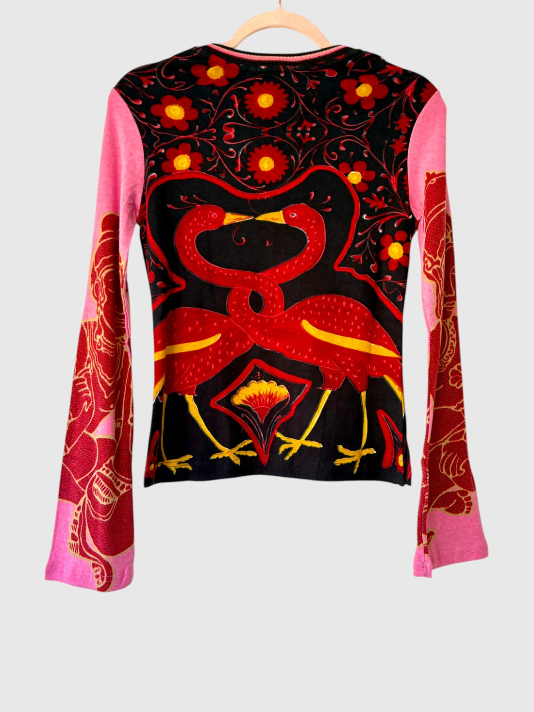 Back view of Custo Barcelona Morrison Birds long sleeve top showing red intertwined birds, floral graphics and contrasting pink sleeves