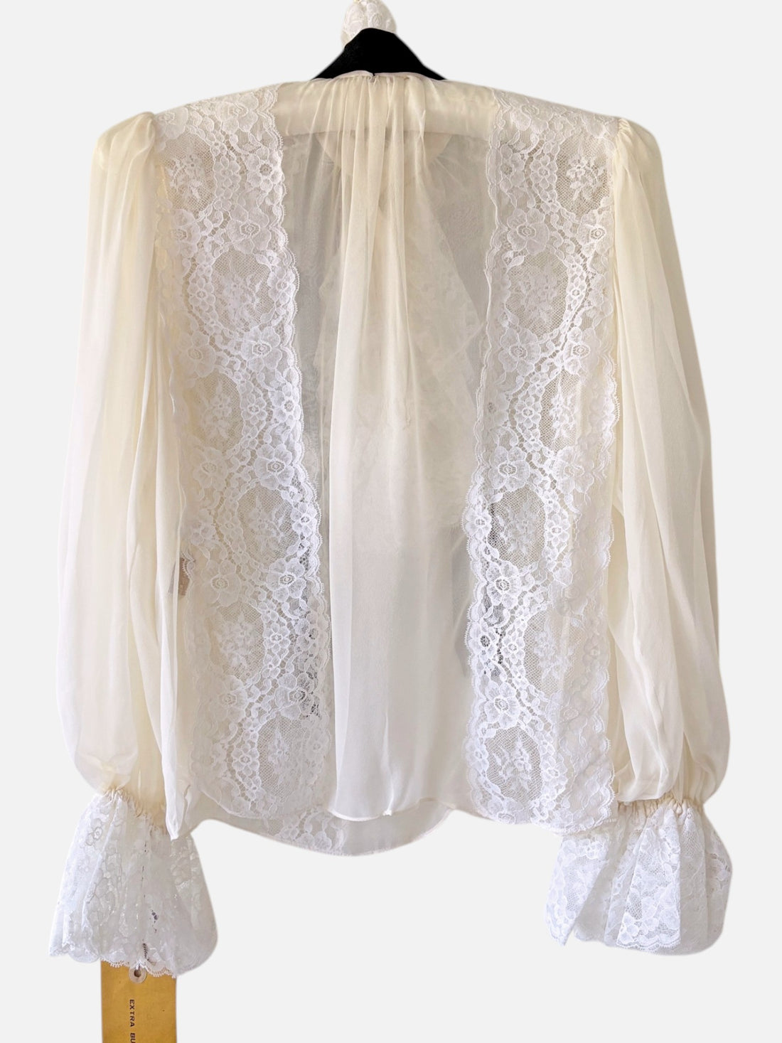 Back view of ivory chiffon Oscar de la Renta blouse with lace paneling