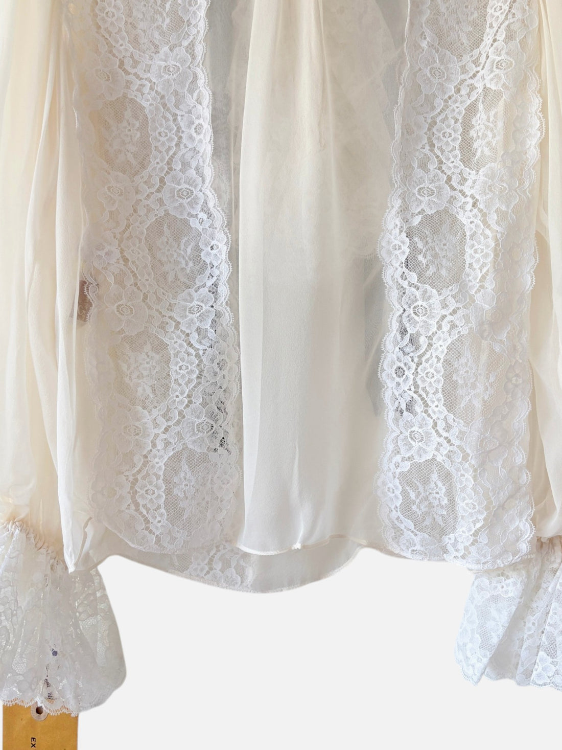 Lower back view with lace cuff detail on Oscar de la Renta blouse