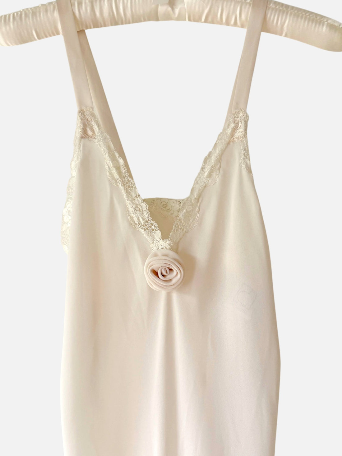 Close up floral lace and rosette detail on Eve Stillman dress