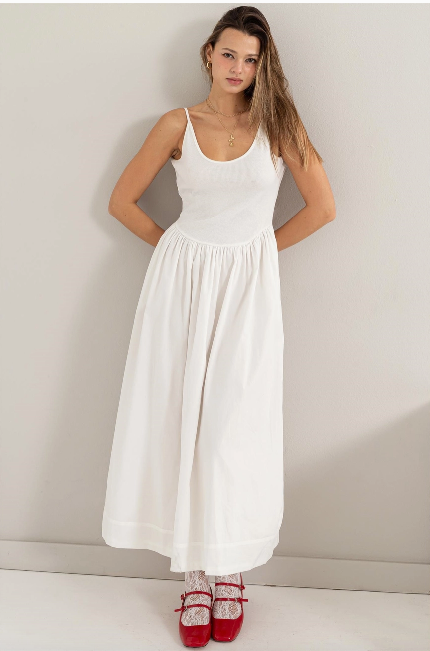 Trendy summer maxi dress. Casual and versatile dress it up or down. Ribbbed upper body and flowing skirt with scoop back. 