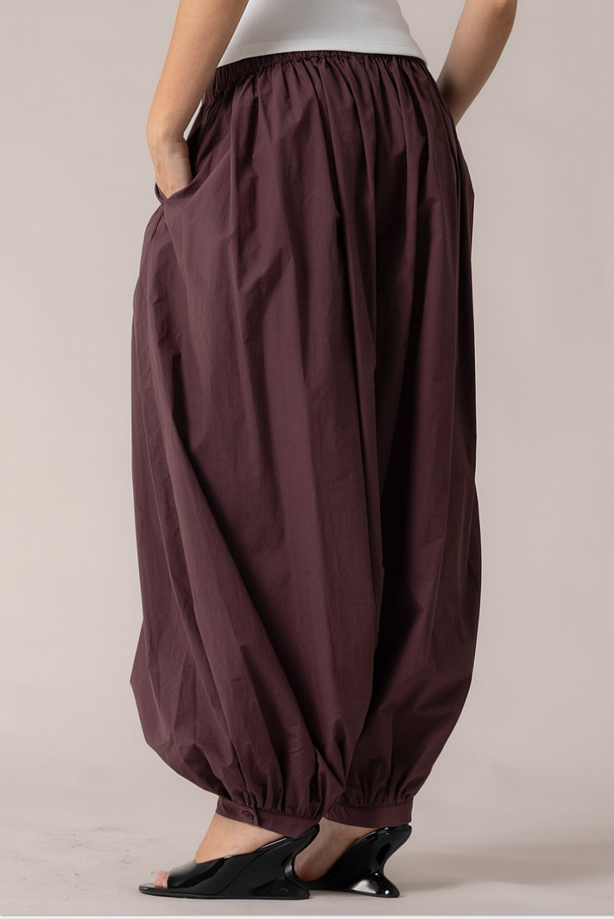 Back view of merlot cotton harem pants showing relaxed fit and gathered hem