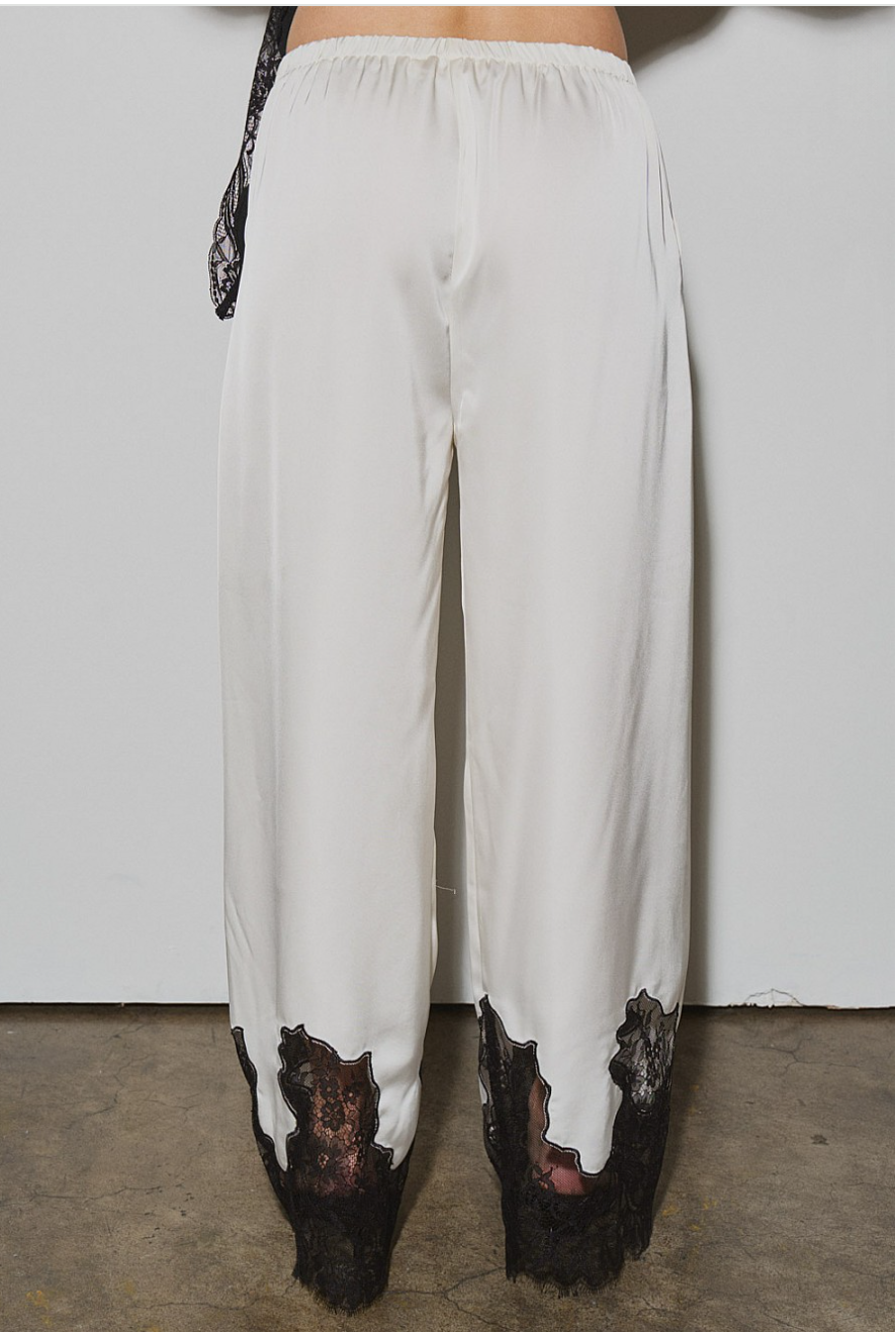 Back view of ivory satin wide-leg trousers with black lace hem, front view, elastic waist