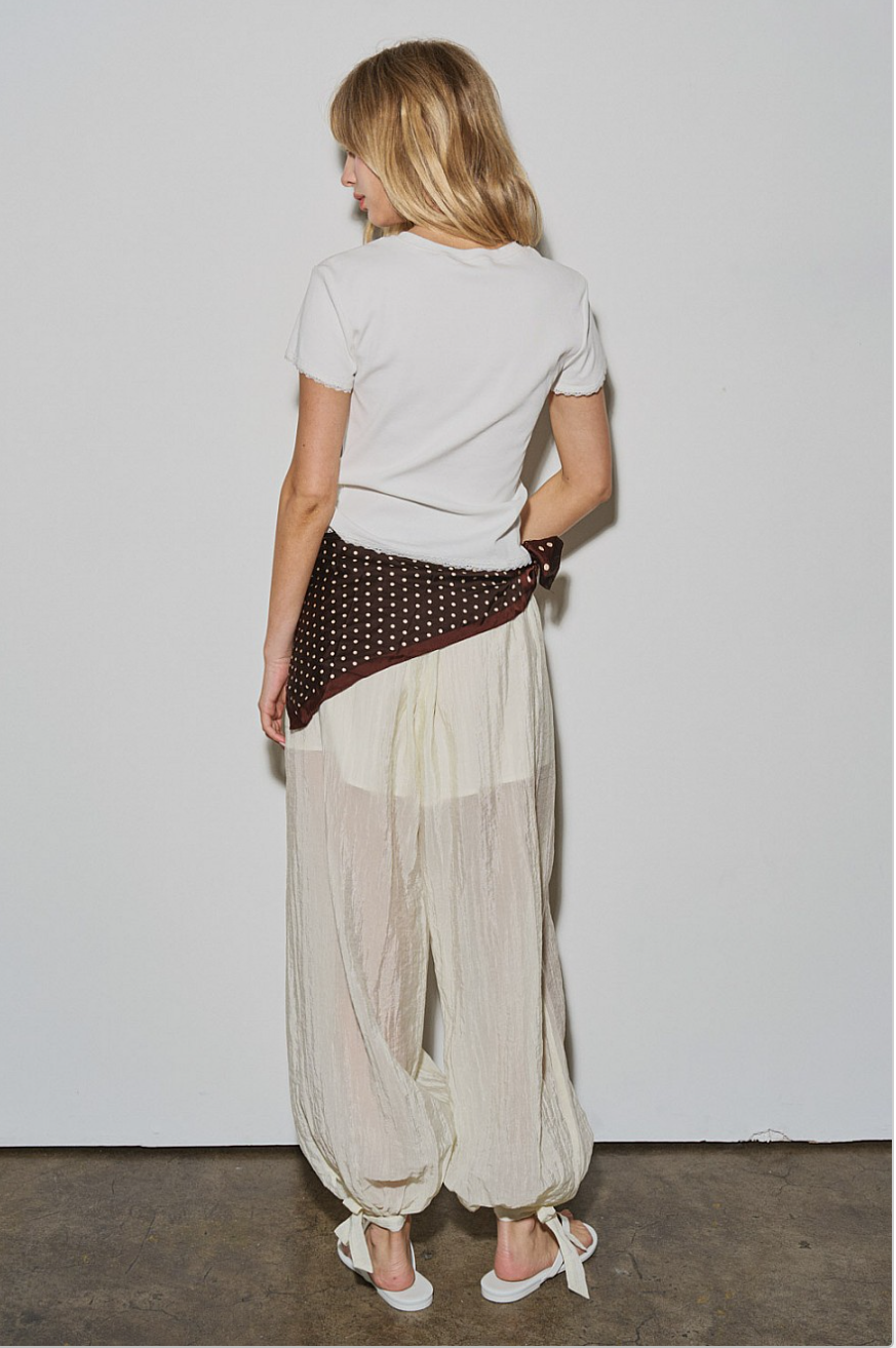 Back view of Willow Balloon Pant on model, sheer textured fabric with built-in short lining.