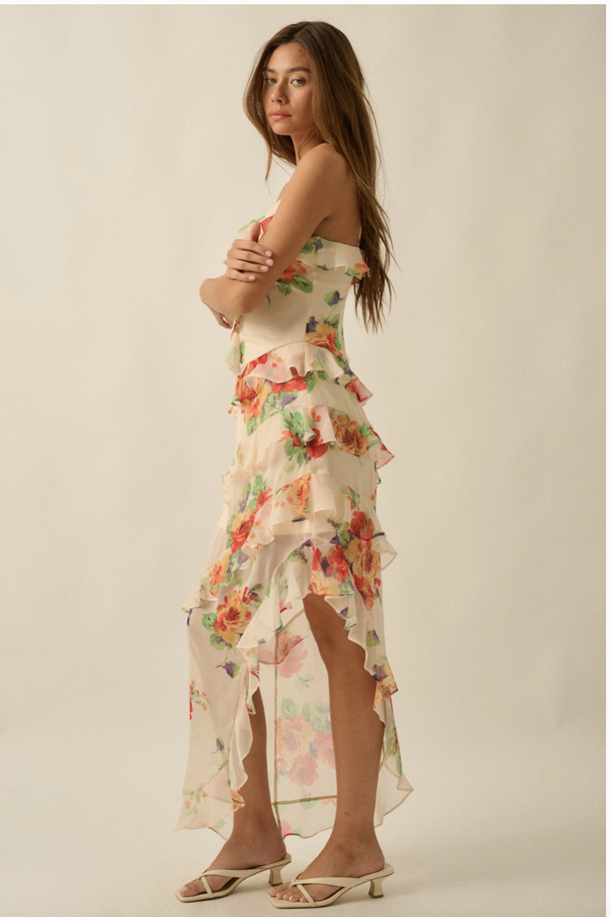 Side view of floral chiffon maxi dress with cascading ruffle layers and flowing asymmetrical silhouette