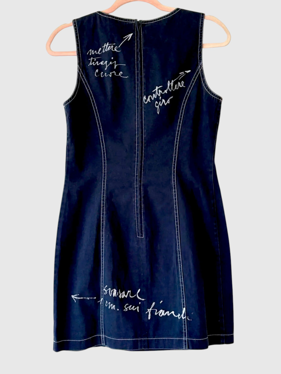 Back view of vintage Moschino Jeans denim dress with white script graphics