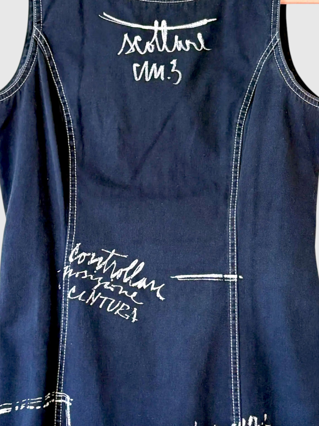 White handwritten graphic print detail on vintage Moschino denim dress