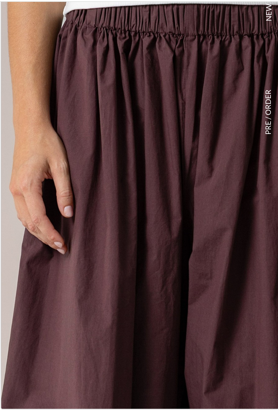 Close-up of elastic waistband and pleating on merlot cotton harem pants