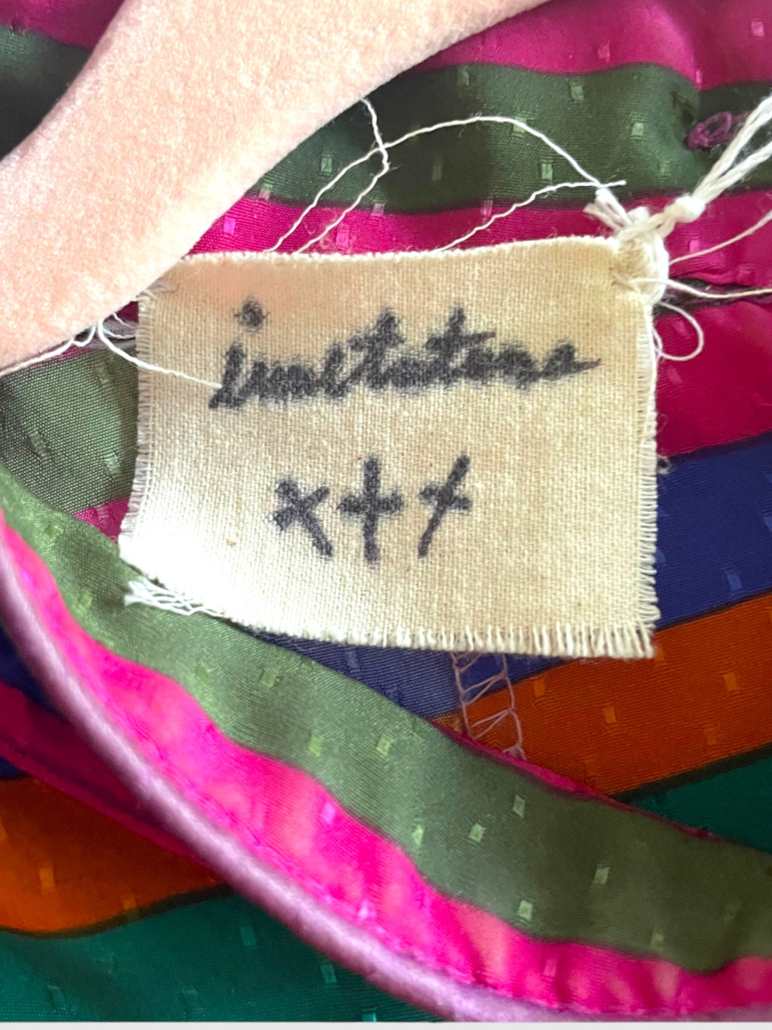 Handwritten Imitation of Christ label inside studio dress