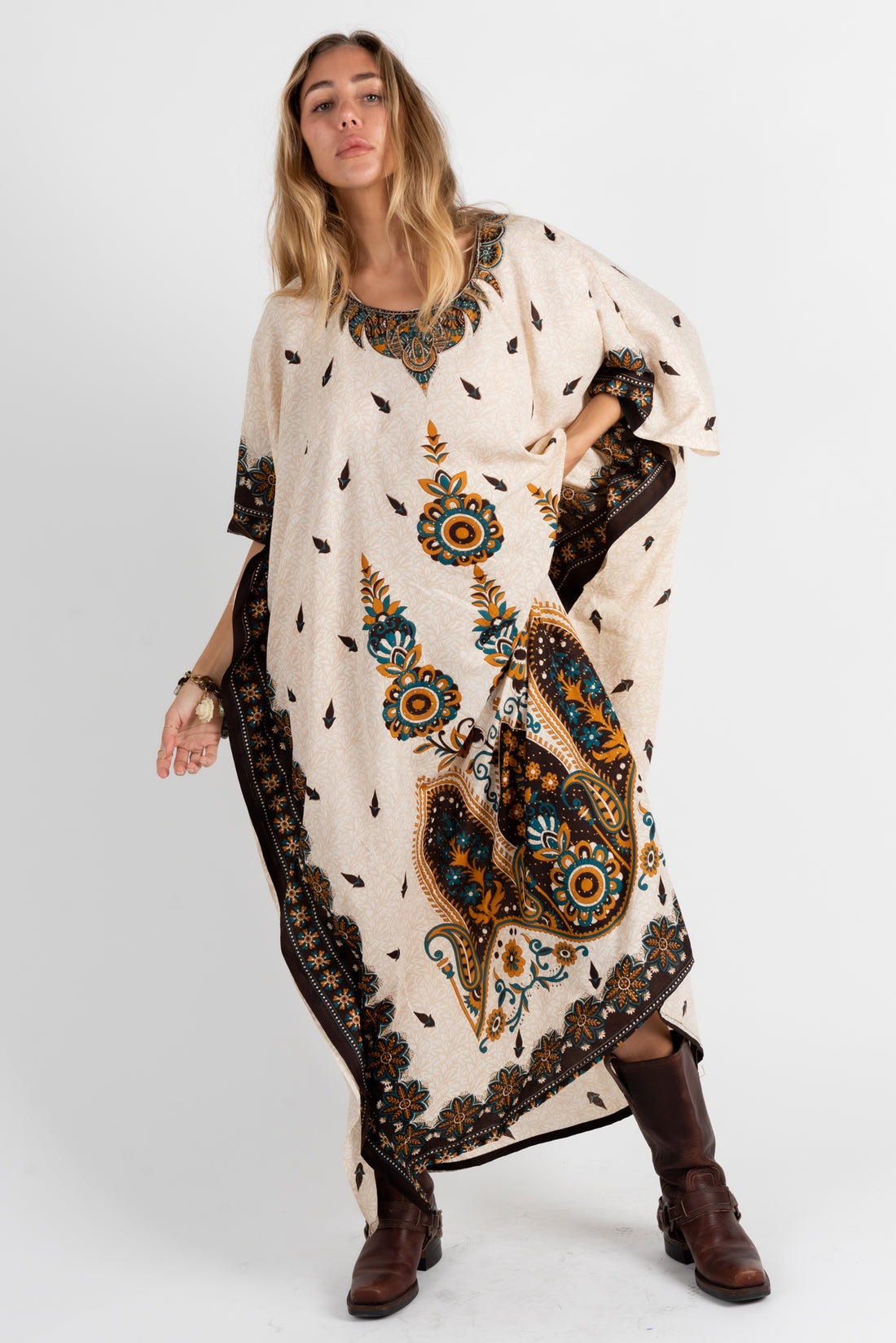 Front view of vintage 1970s cream and teal paisley caftan dress